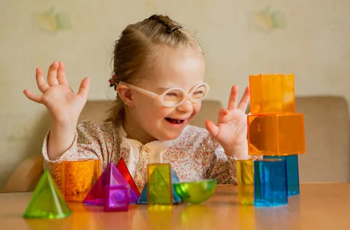 A child exploring colorful building blocks during play